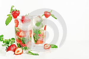 Antioxidant cold summer cocktail with strawberries, mint and soda.