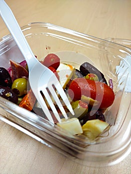 Antipasti in a plastic container