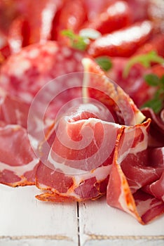Antipasti Platter of Cured Meat, jamon, sausage, salame on whi photo