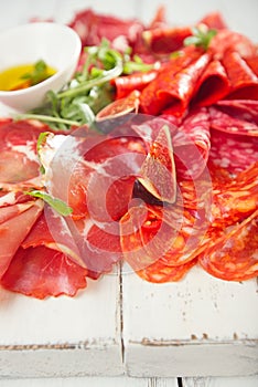 Antipasti Platter of Cured Meat, jamon, sausage, salame on whi photo