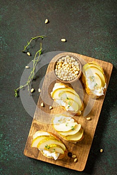 Antipasti snacks for Wine. Brushetta with Soft Cheese and Pear served