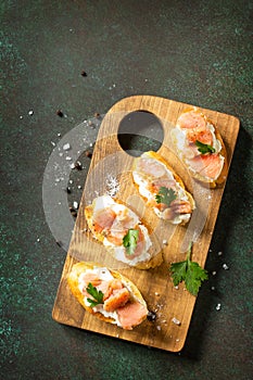 Antipasti snacks for Wine. Brushetta with Soft Cheese and Salmon