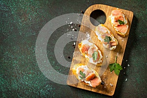 Antipasti snacks for Wine. Brushetta with Soft Cheese and Salmon