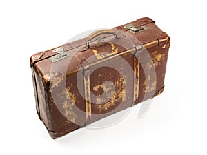 Antiquated and used suitcase photo