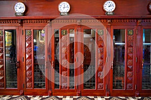 Antiquated red painted telephone boxes inside Ho Chi Minh Central Post Office. Historical Central Post Office of former Saigon.