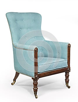 Antique arm chair light blue upholstery isolated on white background