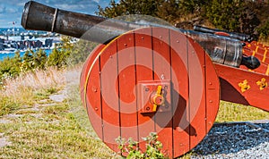 Antique battle gun, cannon on wooden wheels