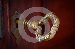 Antique beautiful bronze key in a door