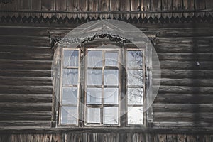 Antique beautiful window in a wooden house.