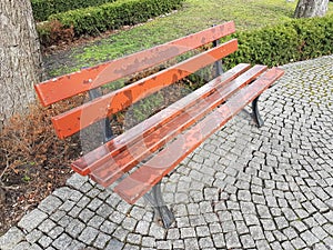 Antique wooden Bench on the beautiful square in Poland photo