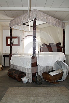 Antique Bedroom with Baby Cradle in St. Augustine Florida Oldest House