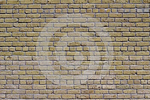 Antique beige brick wall texture in common bond brickwork pattern