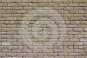 Antique beige brick wall texture in common bond brickwork pattern