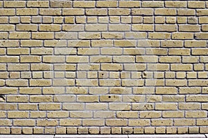 Antique beige brick wall texture in common bond brickwork pattern