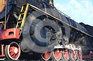 Antique black retro-train on track. A monument to the industrial achievements of the Soviet Unio