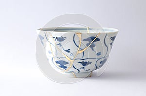 Antique blue and white bowl restored with antique kintsugi real gold technique photo