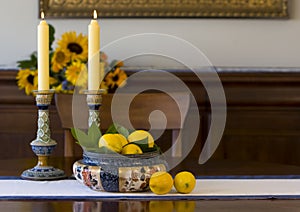 Antique bowl, candlesticks, lemons photo