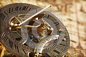 Antique brass compass and sundial photo