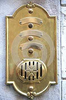 Antique brass doorbell in Italy