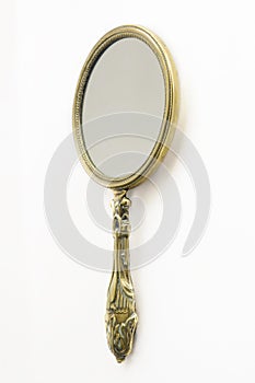 Antique brass hand-mirror