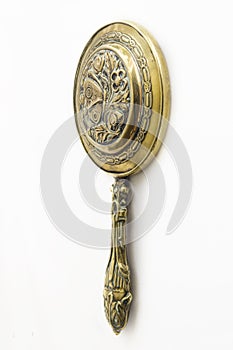 Antique brass hand-mirror