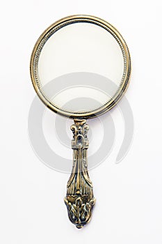 Antique brass hand-mirror