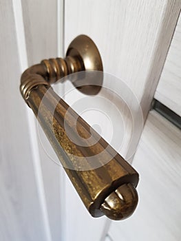 Antique bronze doorknob on the door