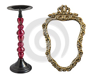 Antique candlestick and a beautiful frame for a mirror isolated on white background