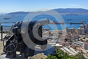 Antique cannon on a background of the bay