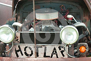 Antique Car Engine and Sign