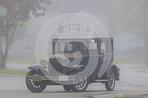 Antique car in fog