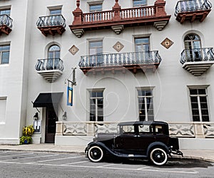 Antique Car in Front of Historic Hotel,