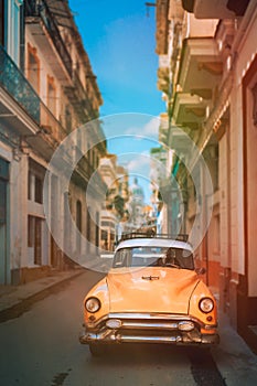 Antique car on a narrow street in Old Havana