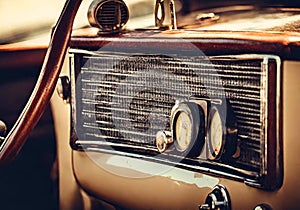 Antique car radio in a classic old car.