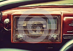 Antique car radio in a classic old car.