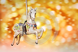 Antique carousel horse, golden festive lights