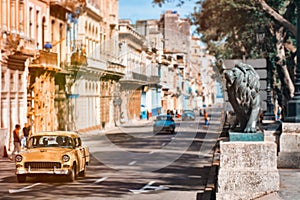 Antique cars at the famous Prado avenue in Old Havana