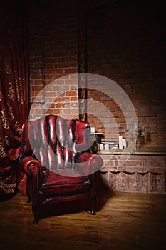 Antique chair against a brick wall