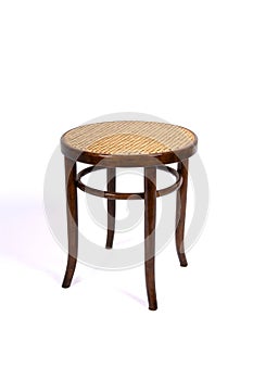 Antique chair without back on white background. Beech bentwood furniture with caned seat and backrest