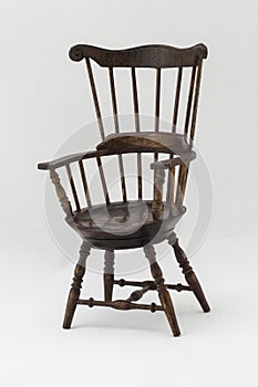 Antique chair in front of white background