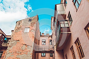 Antique Chapped Vintage Old Arhitecture Yard with Balcony,Blue Sky,Toned