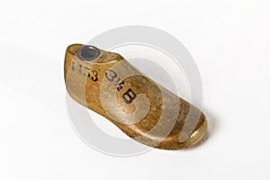 An Antique Children`s Shoe Form on a white background