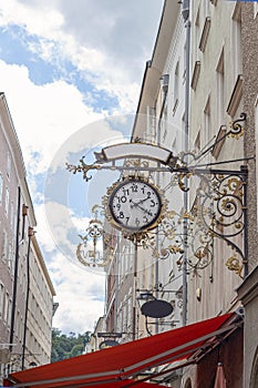 Antique Clock on Historic Getreidegasse, Salzburg, Austria photo