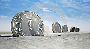 Antique Clocks In Desert Sand