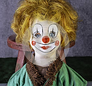 Antique clown doll head with red hair