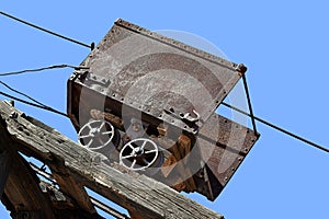 Antique coal car high up on the tracks
