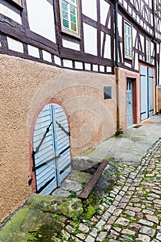 Antique coal cellar door at an old half timbered house in Ruedesheim am Rhein, Germany