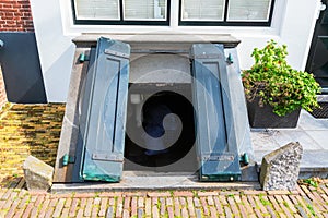 Antique coal cellar door in Veere, Netherlands