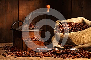 Antique coffee grinder with beans photo