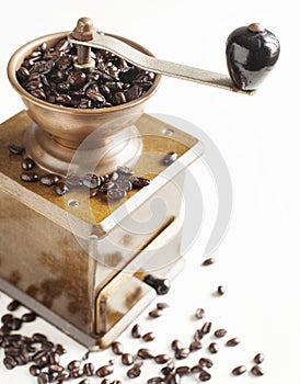 Antique coffee grinder with coffee beans